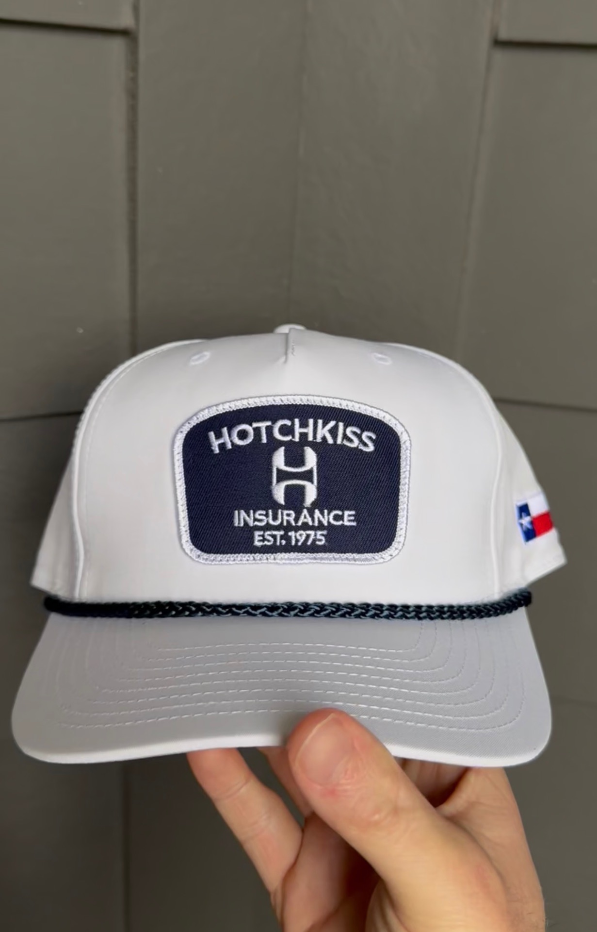 White corporate rope hat with embroidered patch and Texas side detail