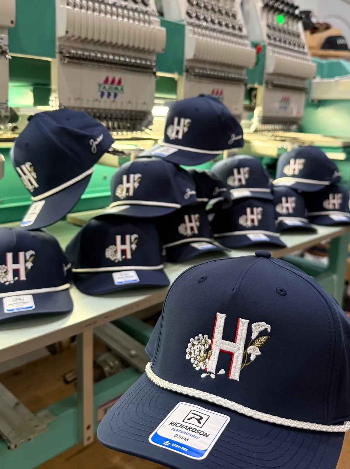 Navy Richardson rope hats with embroidered logo at the embroidery machines